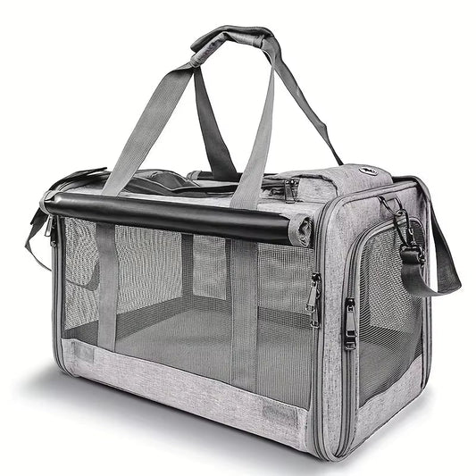 Grey soft-sided cat carrier with mesh panels, a zipped top, grey carry handles and a shoulder strap
