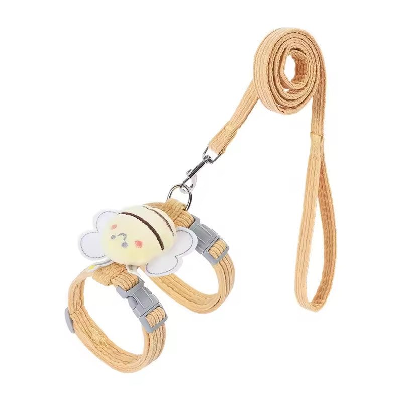 Mustard corduroy strap harness with a plush bee on the back, grey buckles and a matching corduroy lead