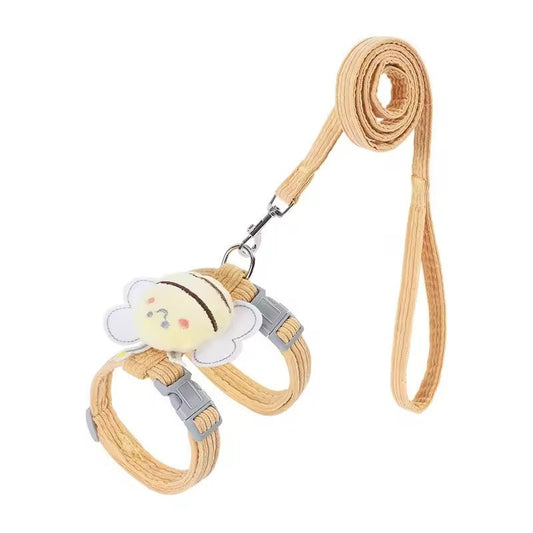 Mustard corduroy strap harness with a plush bee on the back, grey buckles and a matching corduroy lead