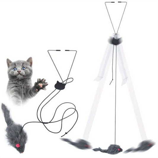 Grey kitten with a raised paw beside the grey furry mouse, its black cord and wire hanger, and a drawing of the mouse swinging below the hanger