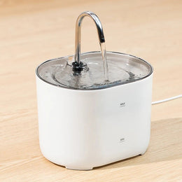 White tap-style cat water fountain with a curved metal spout running water