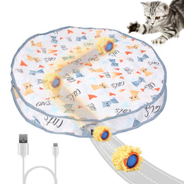 Cloth play pouch with a ball in a fluffy yellow cover rolling out from underneath, a USB cable and a tabby kitten reaching out
