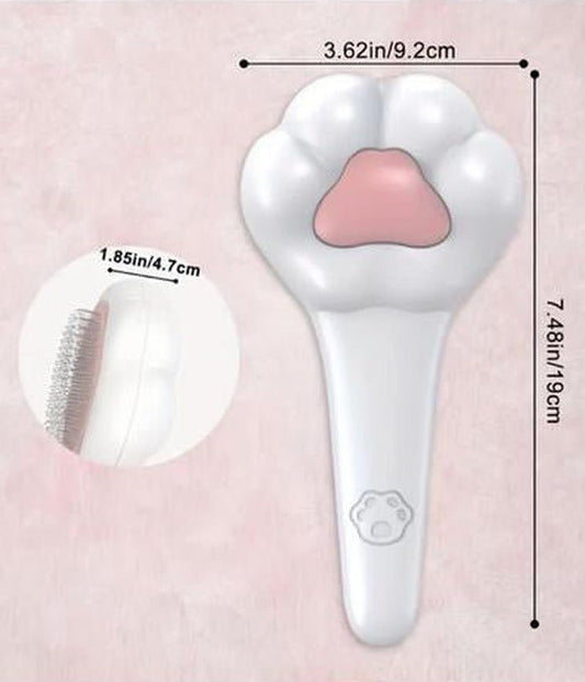 White paw-shaped cat brush with a pink paw pad, marked 9.2 cm (3.62 in) wide and 19 cm (7.48 in) long, with a side view of the 4.7 cm (1.85 in) deep pin head