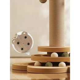 Close-up of the two-tier wooden ball track at the foot of the rope-wrapped post, with wooden and green balls, and an inset of the base underside